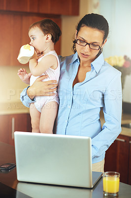 Buy stock photo Mother, baby and laptop for work from home, online planning and business research or multitasking in kitchen. Single mom or freelancer typing on computer with child care balance and project deadline