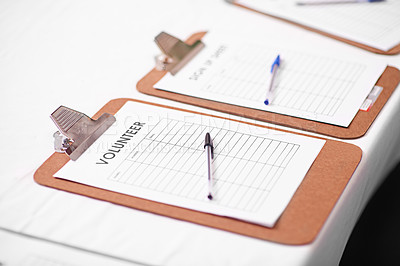 Buy stock photo Shot of a volunteer lists on a table