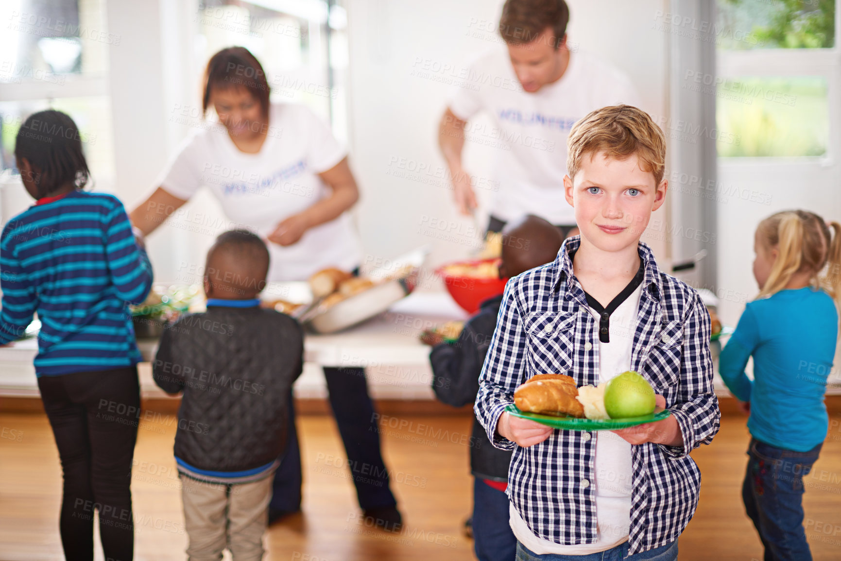 Buy stock photo Young boy, portrait and plate with food at orphanage for charity, shelter or youth center for foster care. Children, kids and orphan with volunteers serving meal, snack or lunch for community society