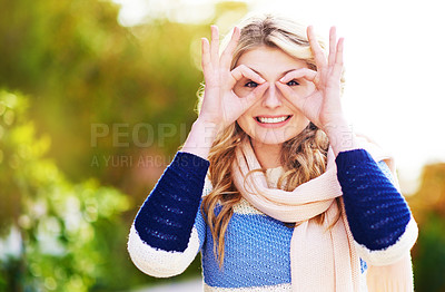 Buy stock photo Cropped portrait of a young woman gesturing playfully outdoors