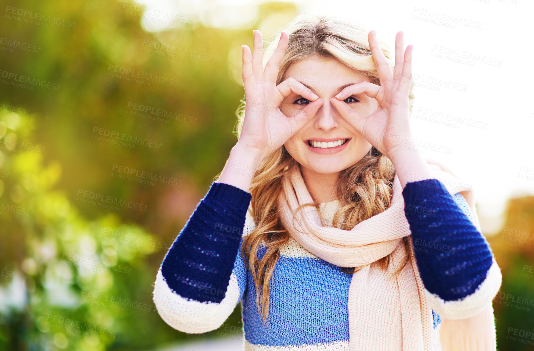 Buy stock photo Cropped portrait of a young woman gesturing playfully outdoors