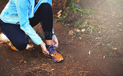 Buy stock photo Hands, runner and nature to tie shoelace on ground for training, exercise or fitness to start morning. Person, athlete and prepare with shoes, sneakers and workout for health on countryside path