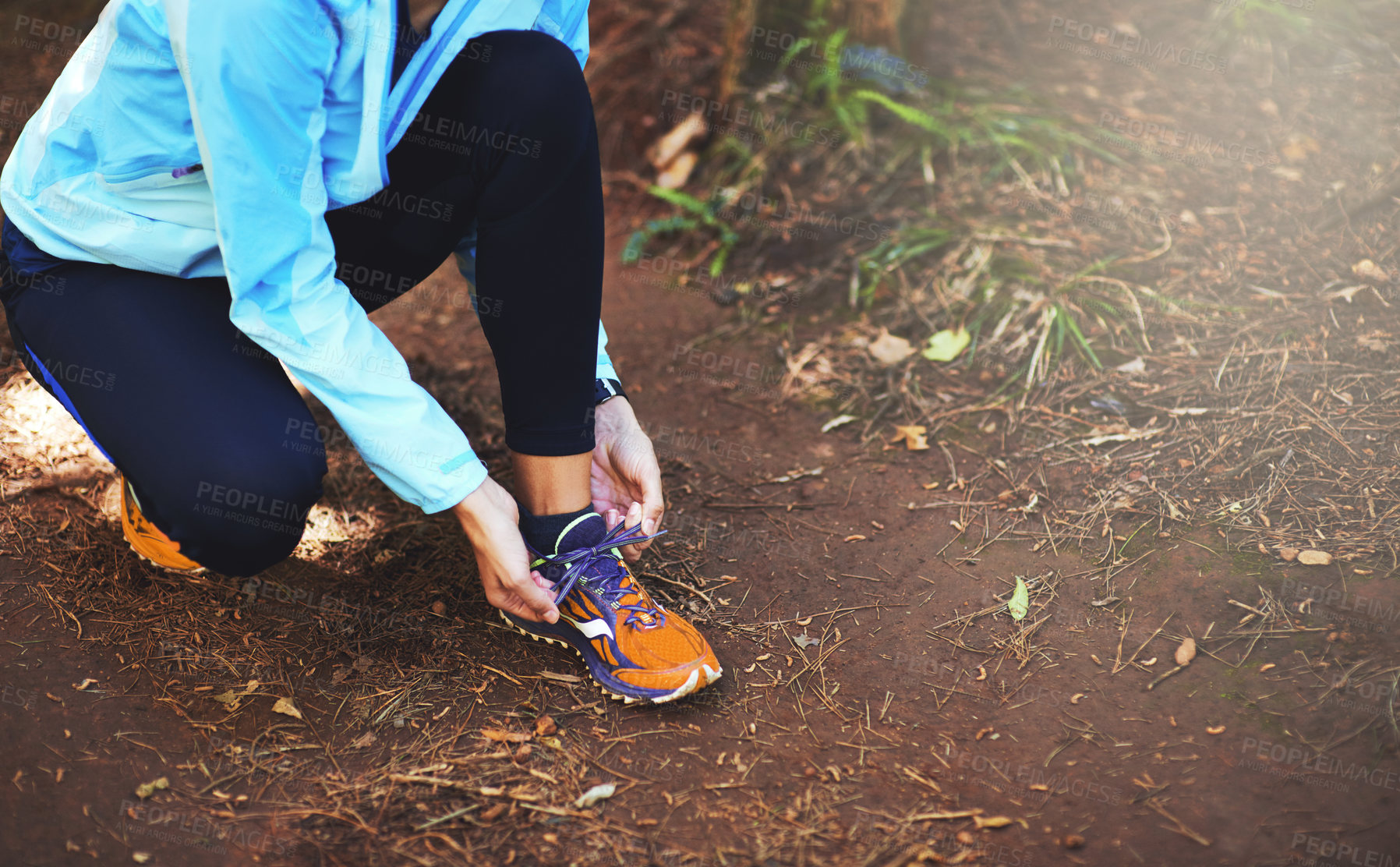 Buy stock photo Hands, runner and nature to tie shoelace on ground for training, exercise or fitness to start morning. Person, athlete and prepare with shoes, sneakers and workout for health on countryside path