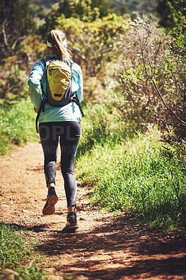 Buy stock photo Back, running and woman hiking on trail in nature on outdoor adventure to explore on holiday vacation. Girl, runner and hiker trekking in woods for training, wellness or travel journey for fitness