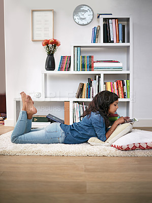 Buy stock photo Black girl, relax and online on floor with tablet for entertainment, social media or streaming trending videos. Person, digital technology and internet for connectivity and scroll on website.