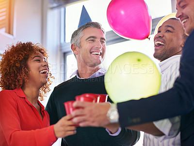 Buy stock photo Cropped shot of a group of coworkers celebrating a birthday