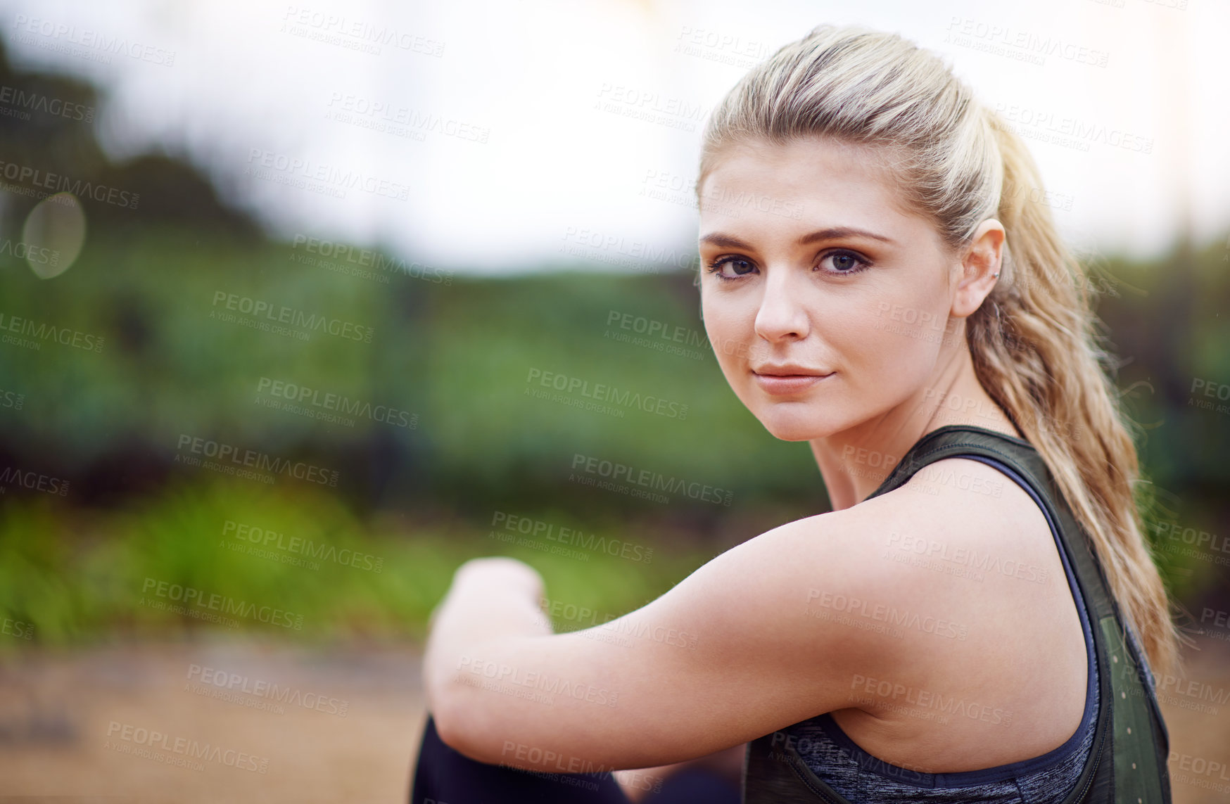 Buy stock photo Cropped portrait of a young woman exercising outdoors