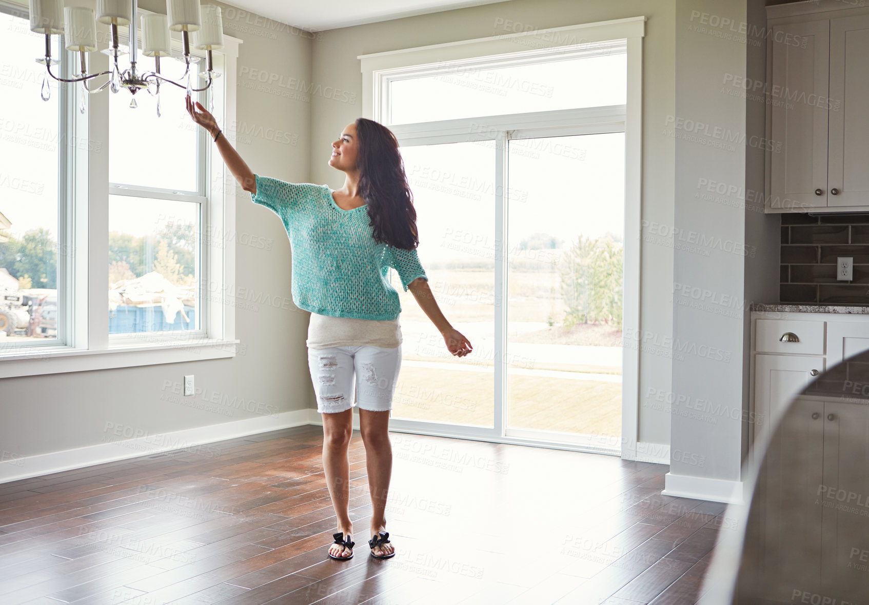 Buy stock photo Shot of a woman moving into her new home