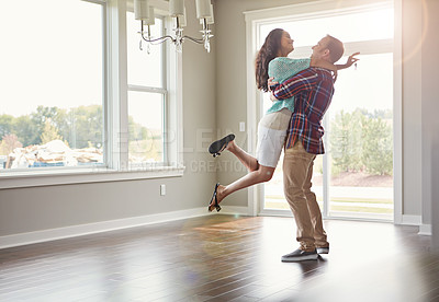 Buy stock photo Happy couple, moving into their new home and hug for mortgage or property buy or together in empty lounge and romance. Real estate, man and woman excited or embrace and romance in the living room 