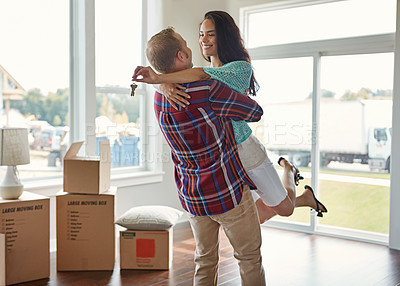 Buy stock photo Happy couple, keys and moving into new home or hug for mortgage or property buy and boxes in empty lounge together. Real estate, man and woman excited for rent or embrace and house with open space 