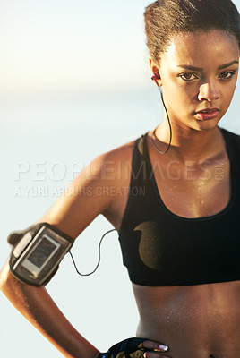 Buy stock photo Woman, portrait and sweat for fitness in outdoor with earphones for training, health and music with app for workout. Female person, athlete and tired in cardio, exercise and tough for sports on break