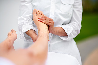 Buy stock photo Woman, relax and foot for massage at spa from therapist for  treatment or pedicure with hands for health or skincare. Professional, therapy and zen with body care or healing for wellness at resort
