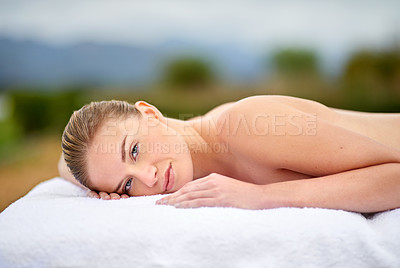 Buy stock photo Relax, portrait and woman lying for spa treatment, wellness or body care on massage bed. Smile, therapy and female person at luxury resort for stress relief, comfort or pamper on tropical holiday