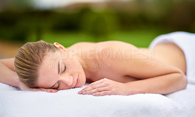 Buy stock photo Spa, relax and massage with woman on bed for healing, treatment or pamper in peace at luxury hotel. Female person, client and sleeping with body care at resort for wellness, peace or rest on vacation
