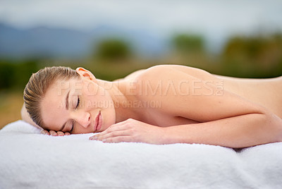 Buy stock photo Woman, relax and massage table in spa, therapy and self care for body wellness and resting for tension. Comfortable and resort with client, stress free and healing, calm session and cosmetology