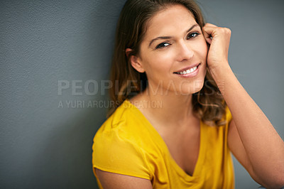 Buy stock photo Woman, portrait and wall on face for thinking with smile, stylish and trendy yellow shirt on grey background. Girl in studio, happy or calm and model for fashion, positive or beauty and mockup space