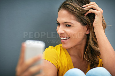 Buy stock photo Happy, confidence and woman with selfie in studio for content creation, memory and online post. Influencer, relax and smile in photography for social media, network and update on grey background