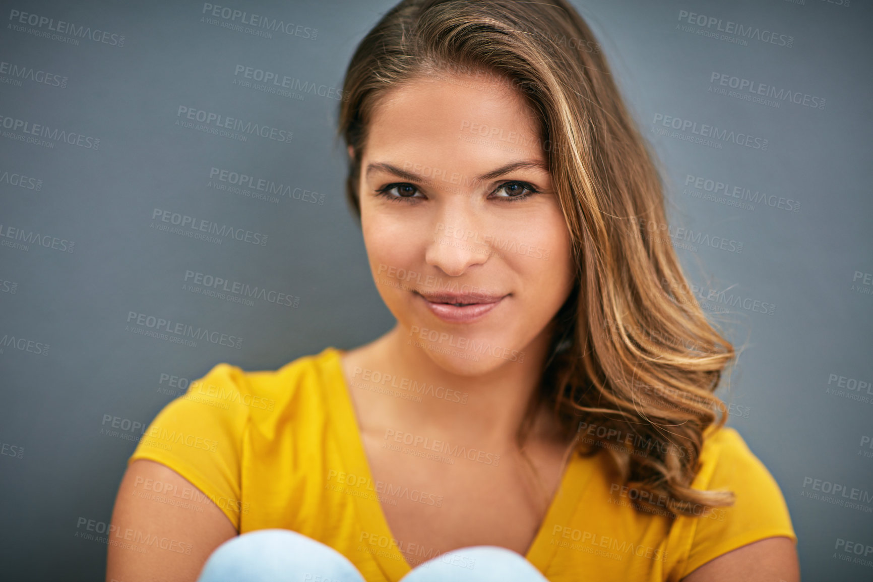 Buy stock photo Wall, relax and woman with tshirt, portrait and smile for weekend, Gen z and streetwear for fashion in house. Grey background, happiness and girl in apartment, cheerful and comfortable in home