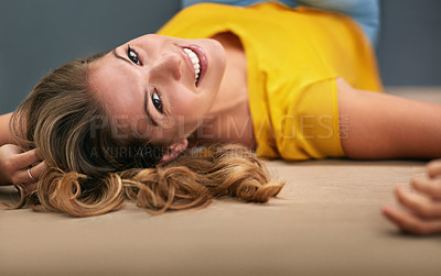 Buy stock photo Portrait, smile and woman on ground, happiness and relaxing with confidence, home and peaceful. Face, person and girl on floor, joyful and calm thoughts with mindset, chilling and carefree weekend