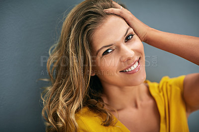 Buy stock photo Portrait, smile and woman in studio for happiness, positive attitude or feel good mood on gray background. Face, confidence and person for relax, cheerful and chilling on weekend with dark backdrop