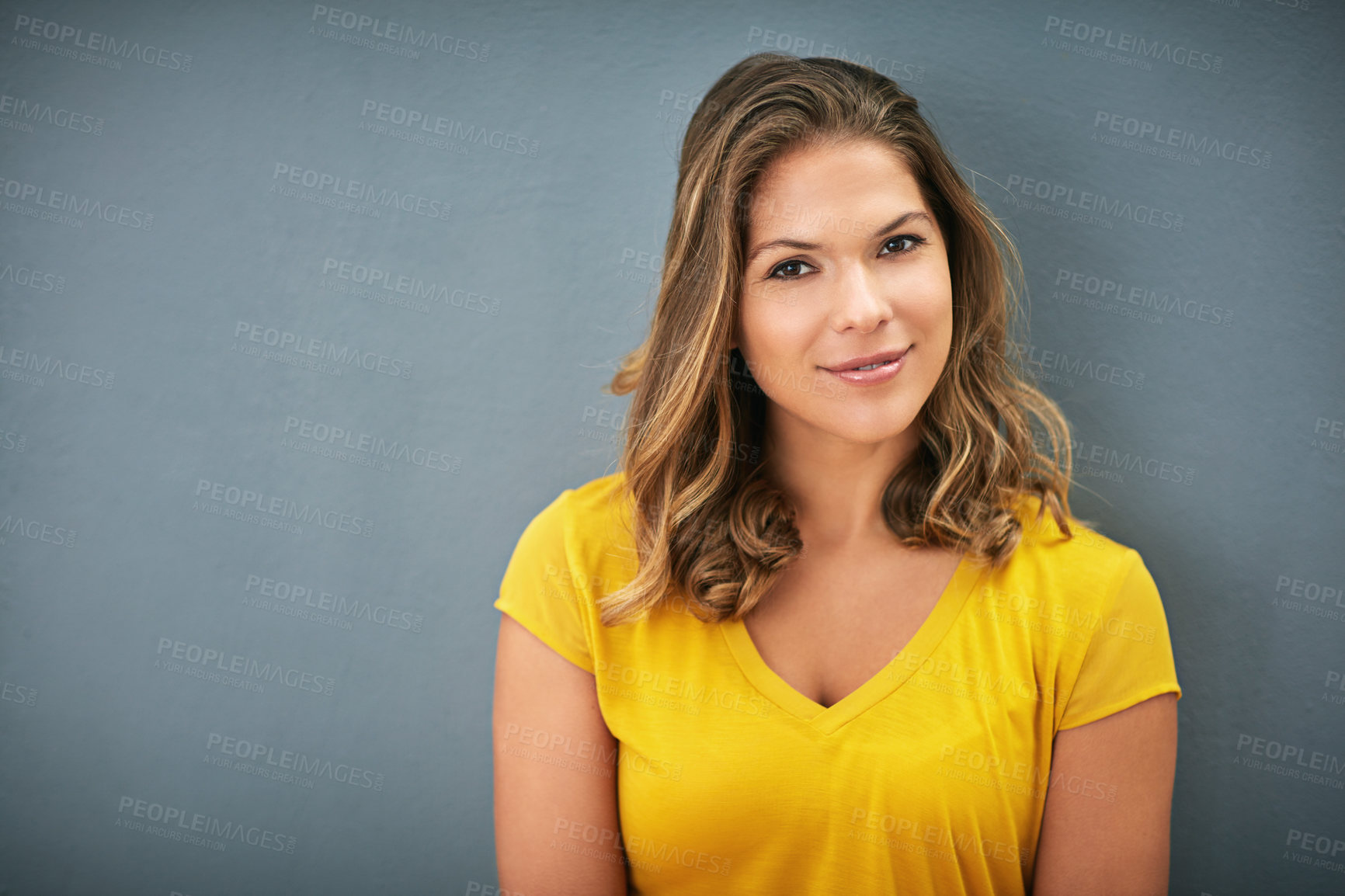 Buy stock photo Studio, portrait and woman with smile, relax and joy of results of student in college of USA. Grey background, wall and learn in course of hairdresser, stylist and university for opportunity in salon