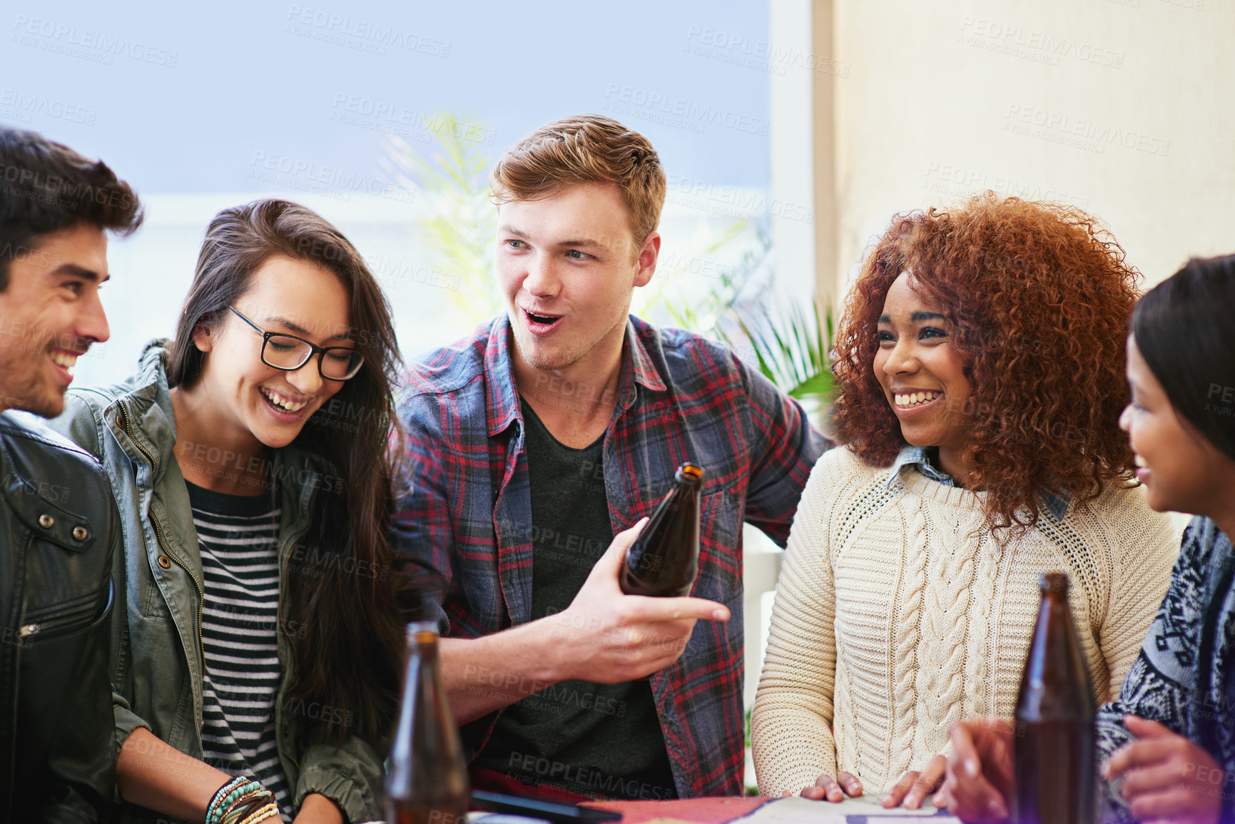 Buy stock photo Friends with beer, outdoor and talking together in pub, restaurant or drinking and reunion on weekend. People, men and women with social gathering, celebration and laugh with happiness or joy 