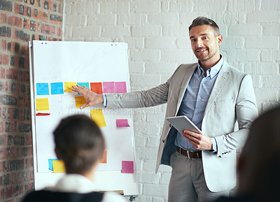 Buy stock photo Cropped shot of a businessman giving a presentation in the boardroom
