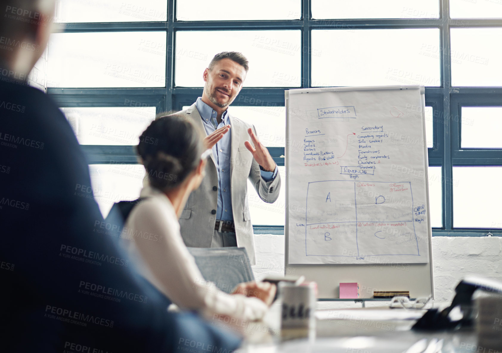 Buy stock photo Cropped shot of a businessman giving a presentation in the boardroom