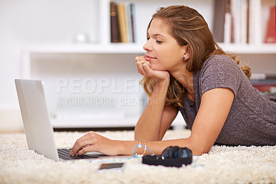 Buy stock photo Laptop, student and woman on floor for elearning, education and studying in home living room. Typing, online lecture and learning for university on carpet, female person and relax for course work