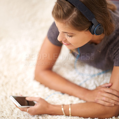 Buy stock photo Social media, headphones or girl with phone for music streaming, subscription or wellness in home. Smile, texting or woman listening to audio, track or song to relax on floor on mobile app for peace