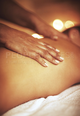 Buy stock photo Cropped shot of a woman enjoying a back massage at a spa