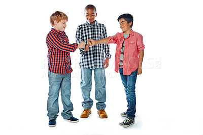 Buy stock photo Studio shot of friends giving each other a fist bump against a white background