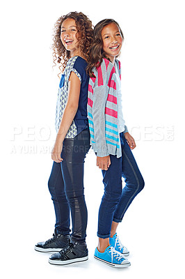 Buy stock photo Studio portrait of two best friends standing back to back against a white background