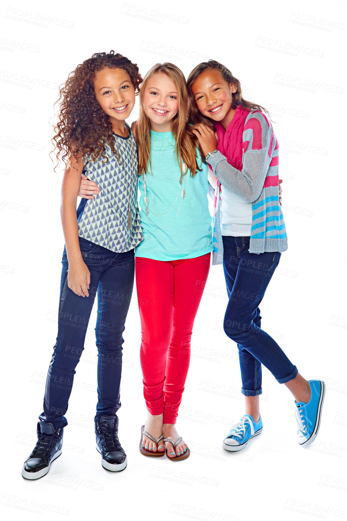 Buy stock photo Studio portrait of a group of young friends posing against a white background