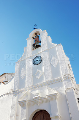 Buy stock photo Church, building and Spain with bell tower and architecture with religious structure and Malaga village attraction.Travel, wall and holiday with vacation in Europe in city with classic style