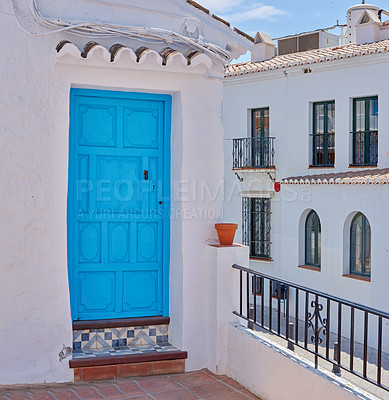 Buy stock photo Door, whitewash and balcony on house for architecture, buildings or travel in Spain. Frigiliana, old city and village design with history for exploration, culture and stone in Europe for aesthetic 