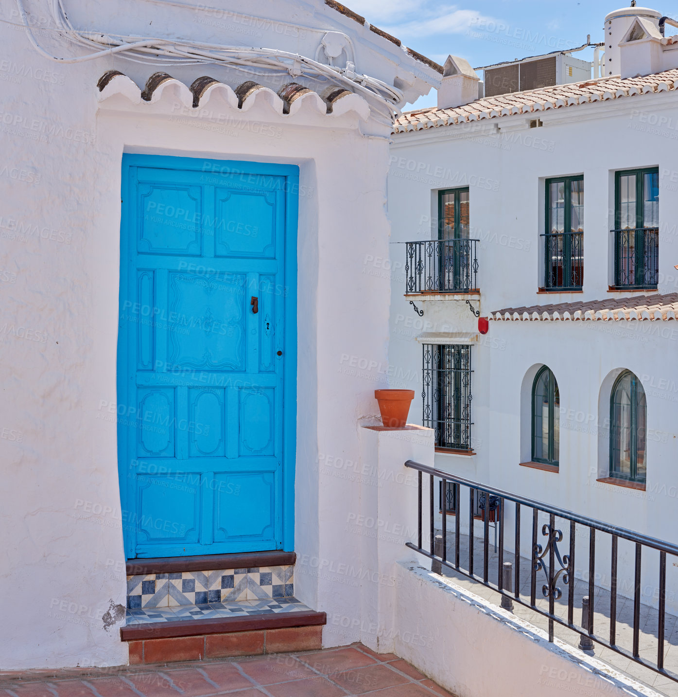 Buy stock photo Door, whitewash and balcony on house for architecture, buildings or travel in Spain. Frigiliana, old city and village design with history for exploration, culture and stone in Europe for aesthetic 