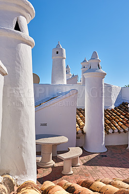 Buy stock photo Architecture, chimney and roof on house in Spain outdoor for travel, vacation and tourism at village in Andalusia. Traditional, rooftop and building for history, culture and blue sky at home in city