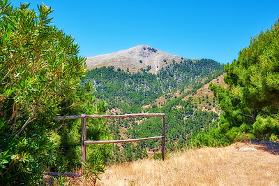 Buy stock photo Landscape, mountain and fence in nature for wallpaper, ecology and healthy environment in Spain. Trees, valley and geology in Ronda for habitat creation, forest or green in countryside for background