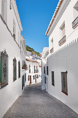 Buy stock photo Narrow street, travel and alley with holiday destination, texture and background in town or city. Wallpaper, outdoor and cobblestone in neighborhood for tourism, adventure or sightseeing for journey