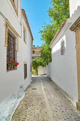 Buy stock photo Road, mountain and travel with old city, vacation or adventure with nature, Frigiliana or Andalusia. Spain, empty or buildings with architecture, outdoor or cobblestone with journey or summer holiday