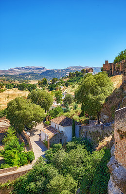 Buy stock photo Village, travel and outdoor for weekend trip in Malaga, Europe summer and trees for peace in town. Buildings, architecture and culture in Spain for tourism, holiday and calm environment on vacation