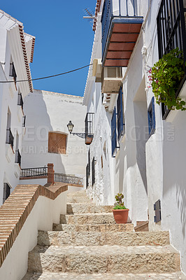 Buy stock photo Buildings, village and steps with architecture, travel and picturesque with vacation or aesthetic outdoor. Infrastructure, town and ancient culture for holiday, alley and tourist location in Spain