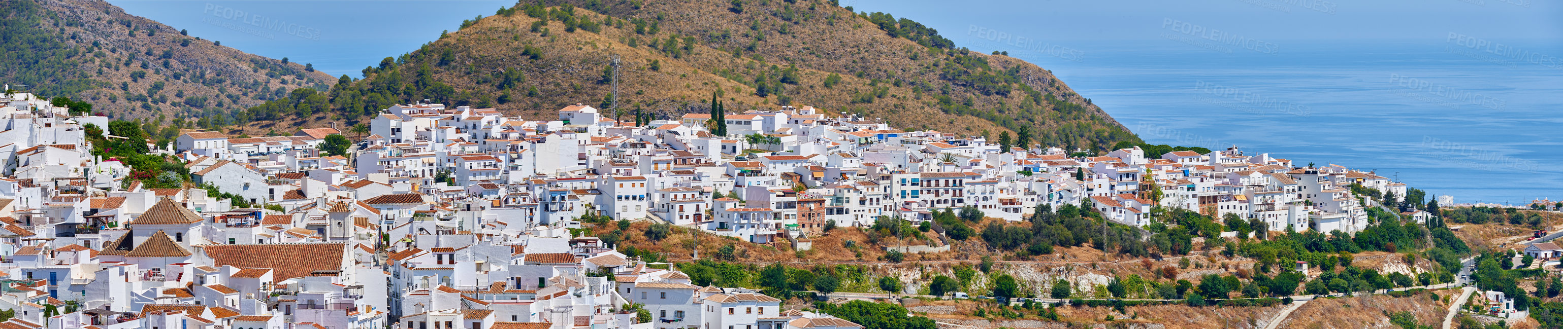 Buy stock photo Drone, city and outdoor to travel in Spain, Europe summer and mountains for peace in town. Buildings, architecture and culture in Frigiliana for tourism, holiday and calm environment on vacation