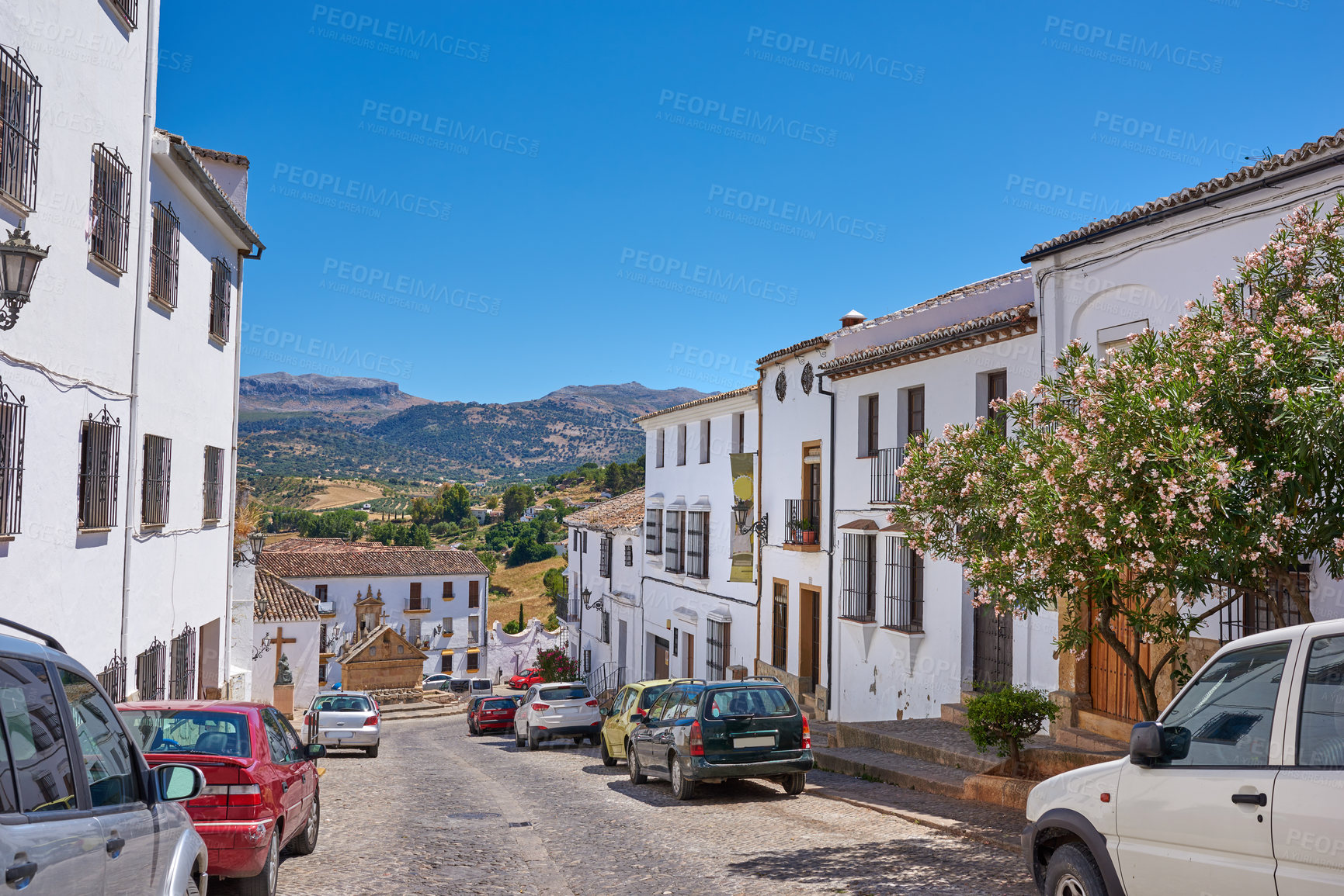 Buy stock photo Outdoor, houses and road with cars in neighborhood with traditional architecture in Italy. Outside, street and village with cultural or vintage design as holiday or vacation destination for tourism