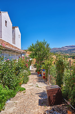 Buy stock photo House, buildings and ancient architecture with plants, countryside and nature, travel location and history village. Property, blue sky and holiday destination, farming and vintage culture in Spain