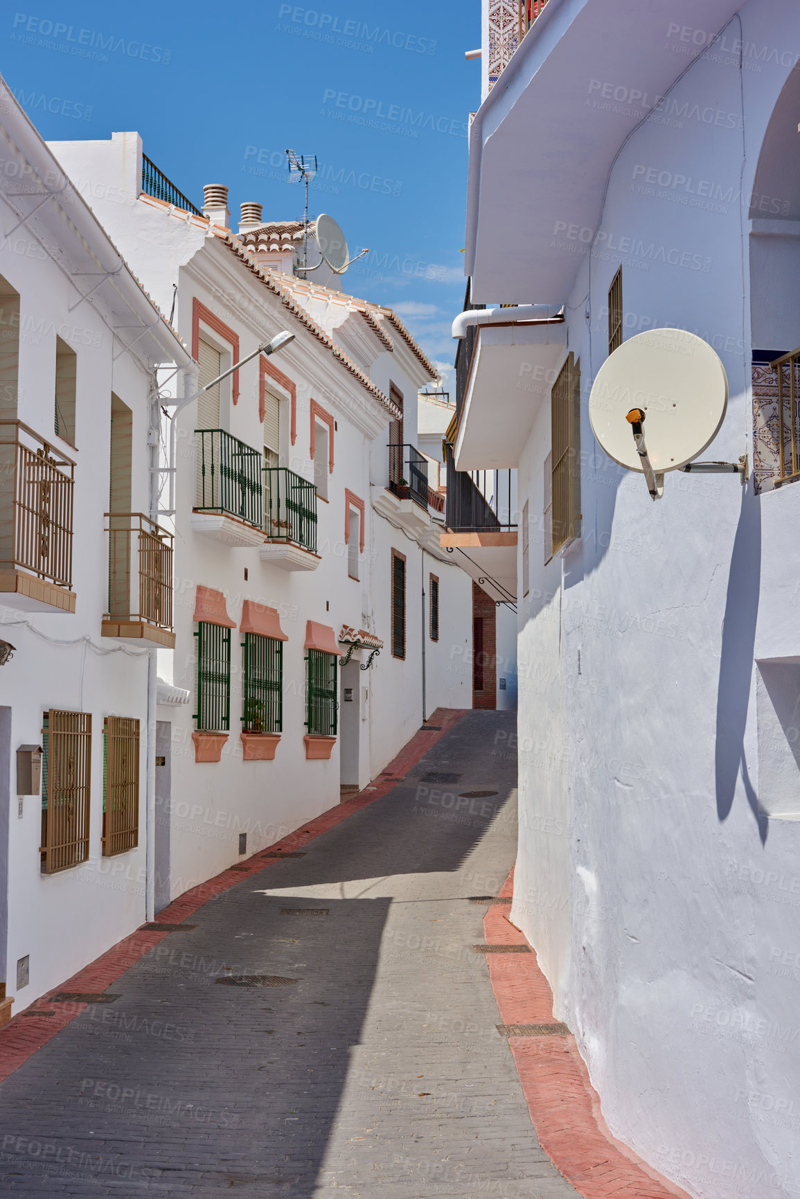 Buy stock photo Outdoor, houses and street in neighborhood with traditional architecture in Spain. Outside, home and road in village with cultural or vintage design as holiday or vacation destination for tourism