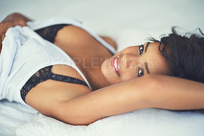 Buy stock photo Shot of a gorgeous young woman posing seductively in her bedroom