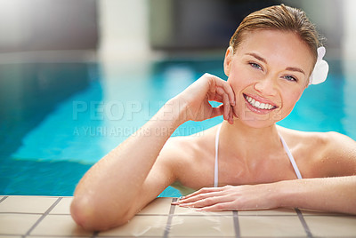 Buy stock photo Shot of a young woman relaxing in the pool at a spa