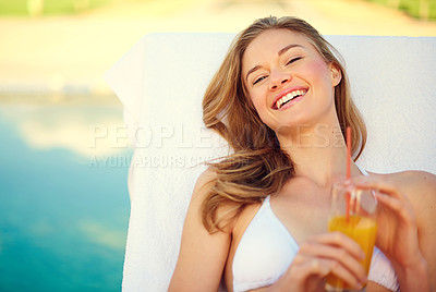 Buy stock photo Portrait of an attractive young woman enjoying a poolside drink
